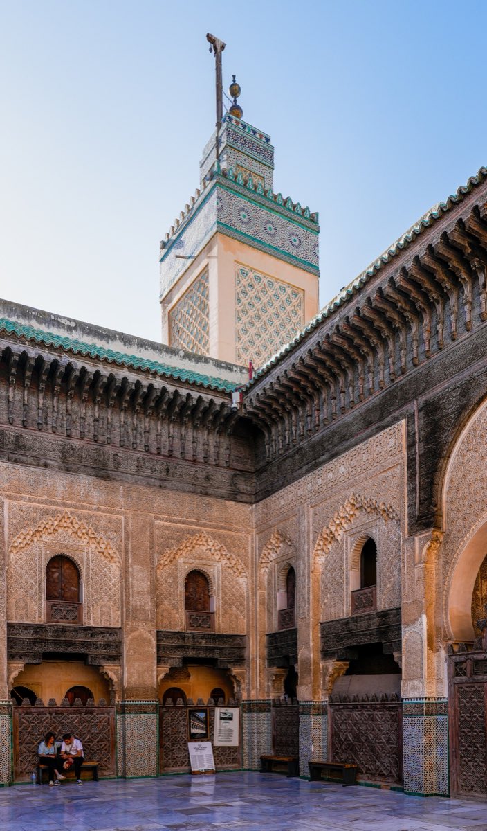 Carved stucco courtyard and minaret of the Bou Inania madrasa