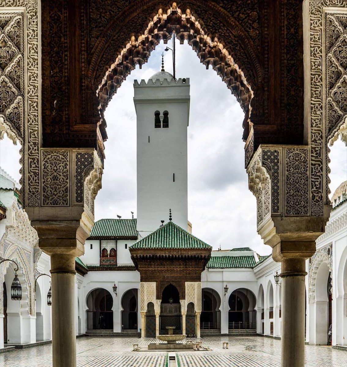 Courtyard of the al-Qarawiyyin mosque with green tiled roofs