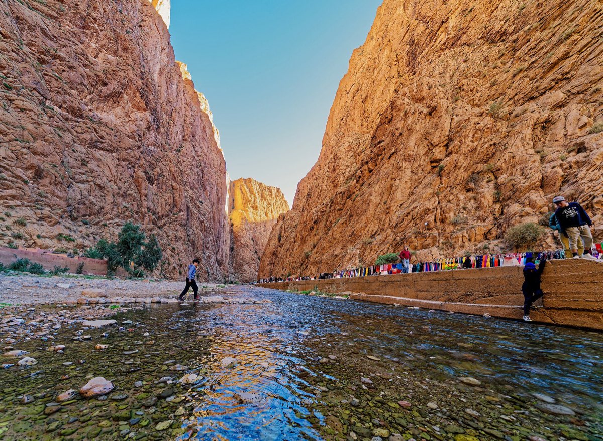 Shallow river between the sheer walls of the Todra gorge